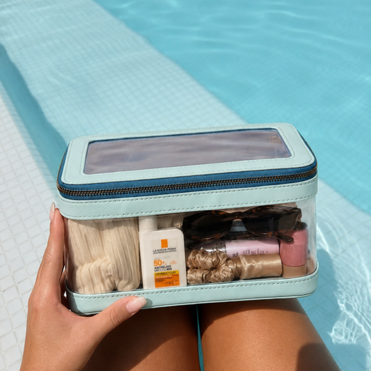 Velvet View Jumbo Case in Blue Haven, held open poolside