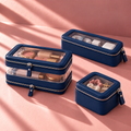 The Travel Trio in Midnight Blue: Double Zip Case with makeup, Slim Case with chargers and Petite Case with jewellery